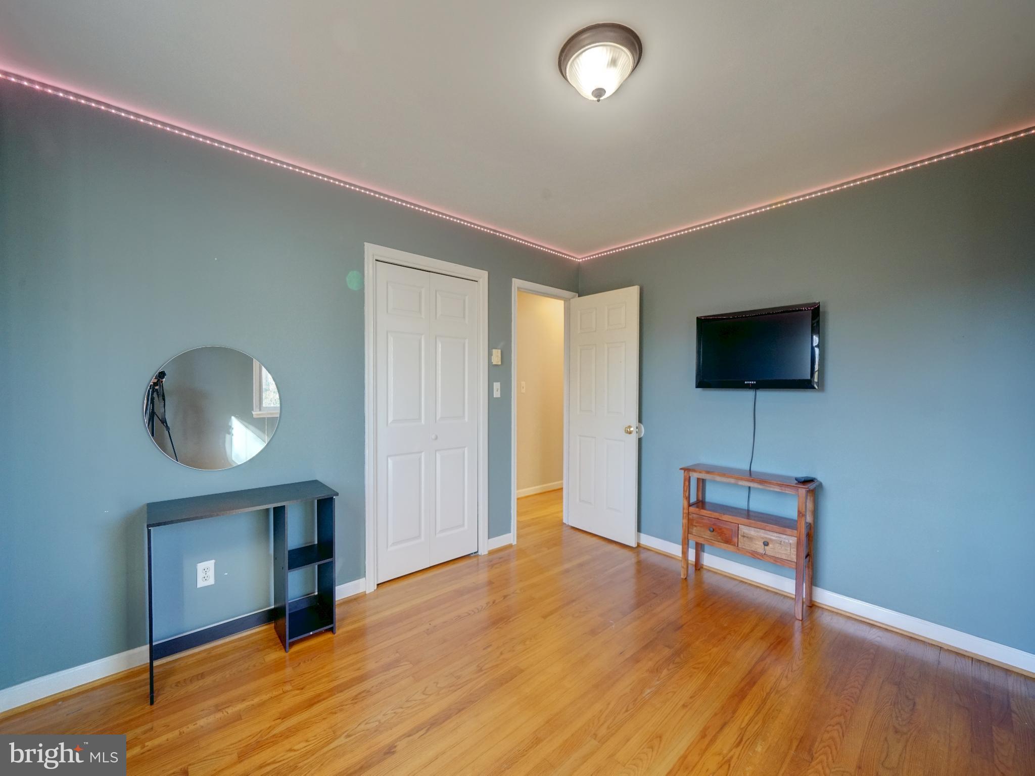 7819 Appletree Road Pasadena, MD 21122 - Photo 24 of 59 Modern room with stylish accents and light.