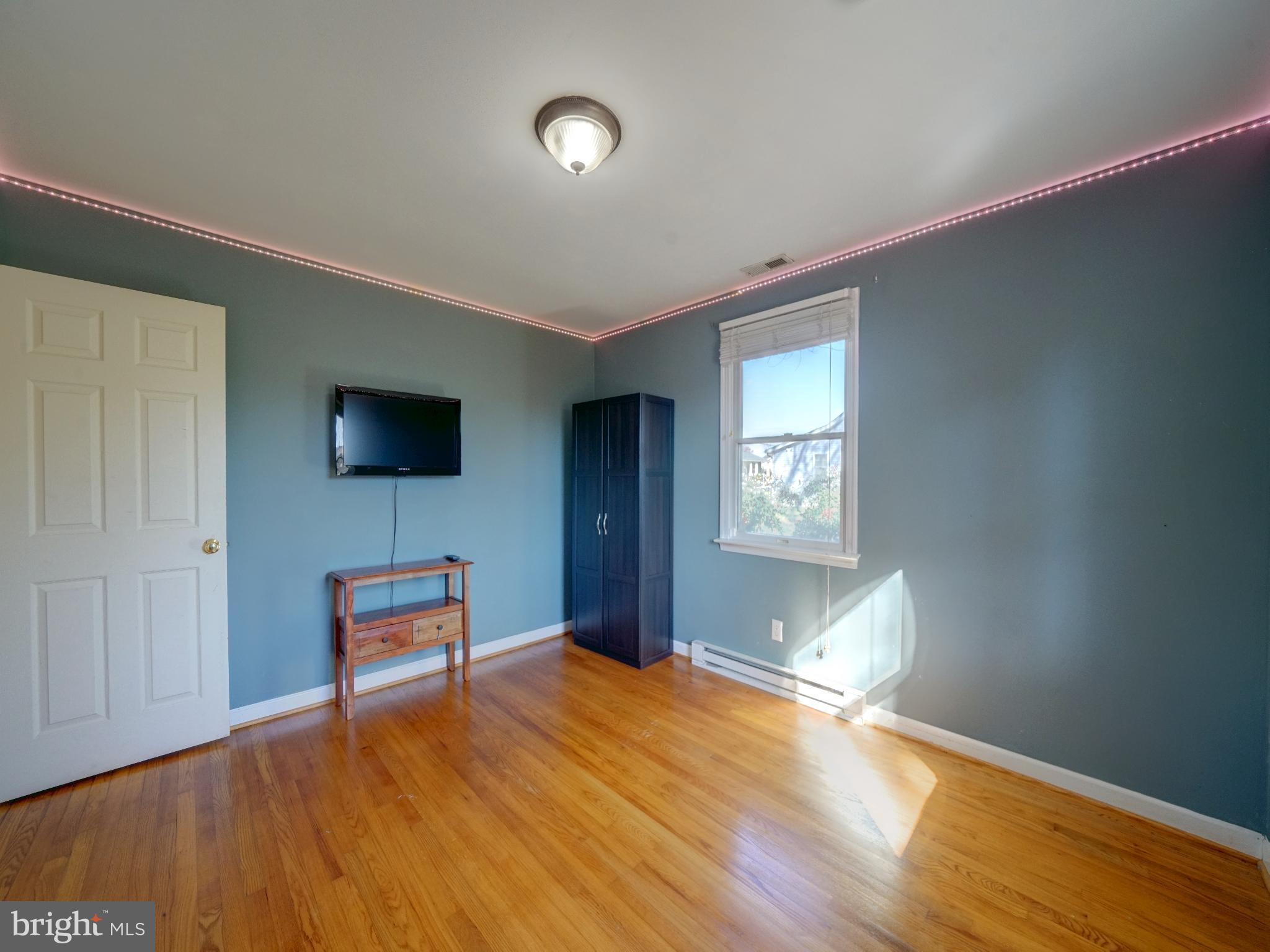 7819 Appletree Road Pasadena, MD 21122 - Photo 25 of 59 Bright and airy room with modern accents.