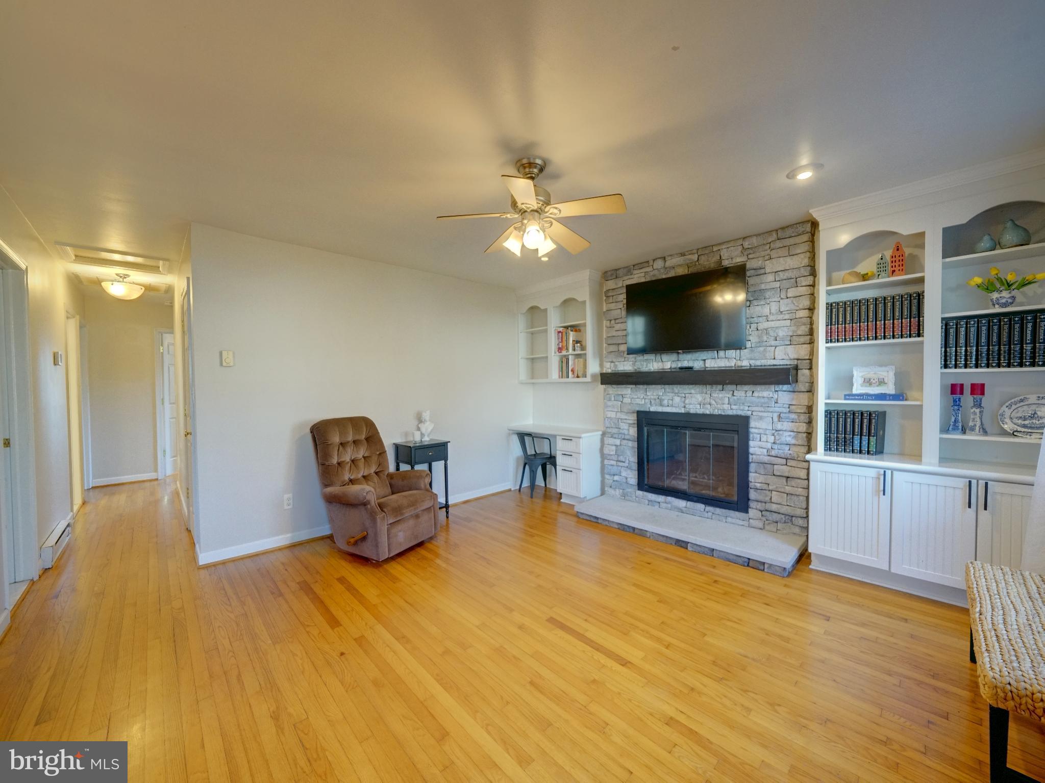 7819 Appletree Road Pasadena, MD 21122 - Photo 3 of 59 Cozy living space with warm wooden floors.
