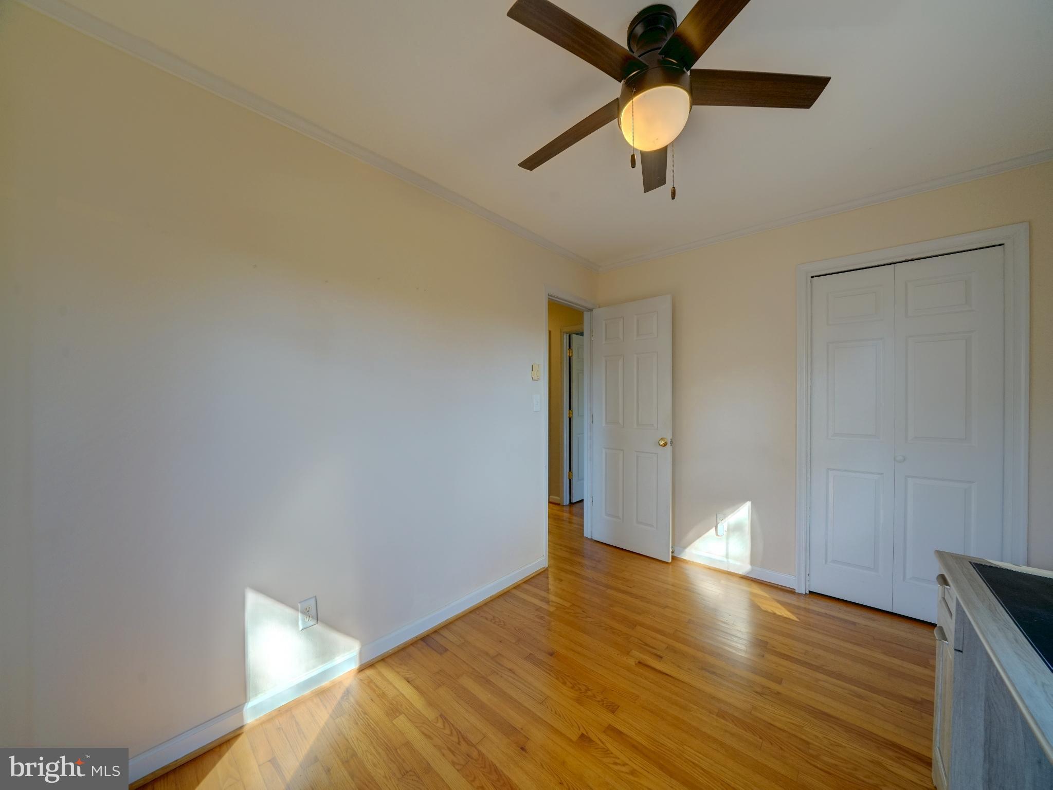 7819 Appletree Road Pasadena, MD 21122 - Photo 32 of 59 Bright and airy room with hardwood floors.