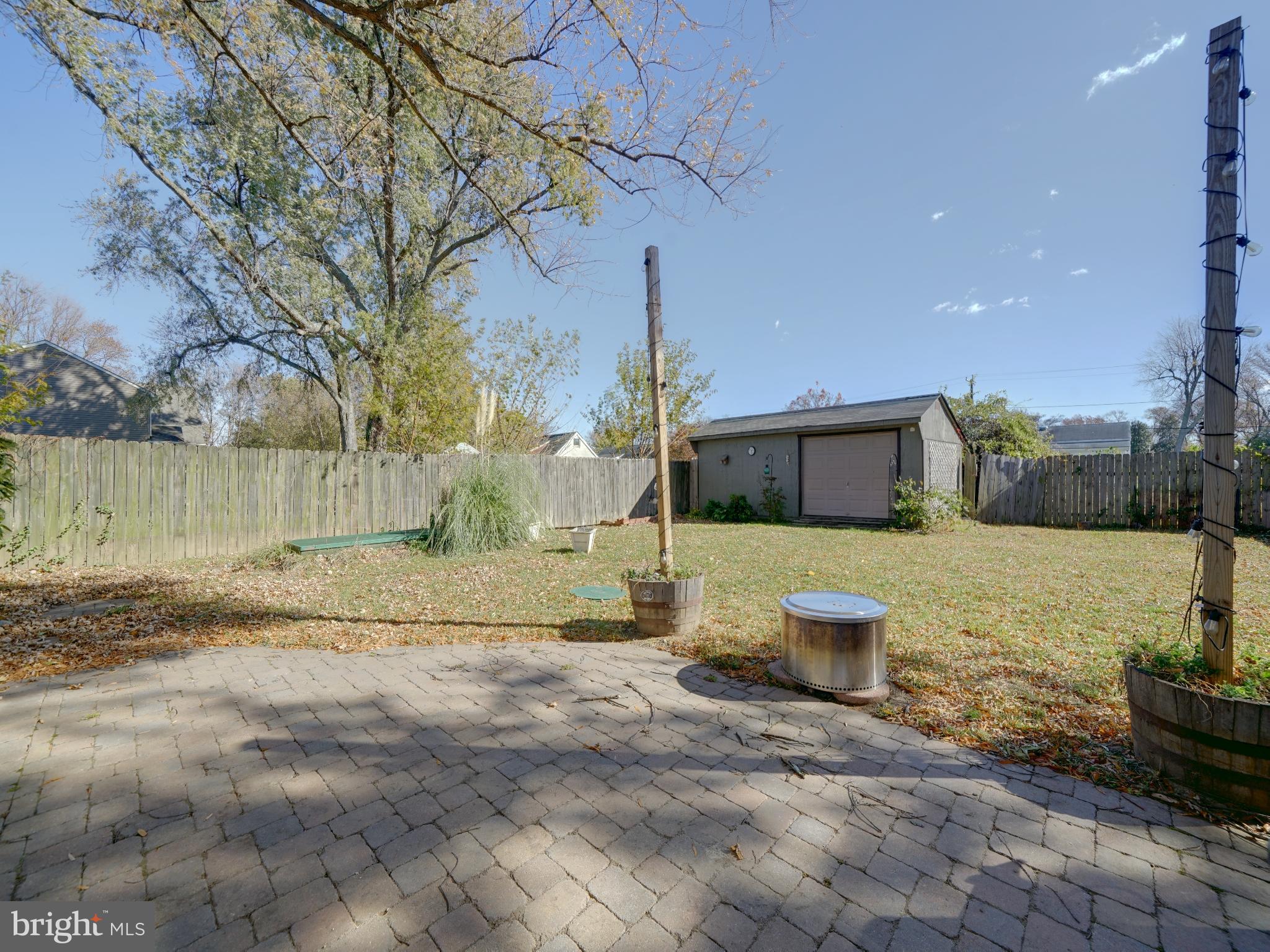 7819 Appletree Road Pasadena, MD 21122 - Photo 34 of 59 Spacious backyard with serene outdoor charm.