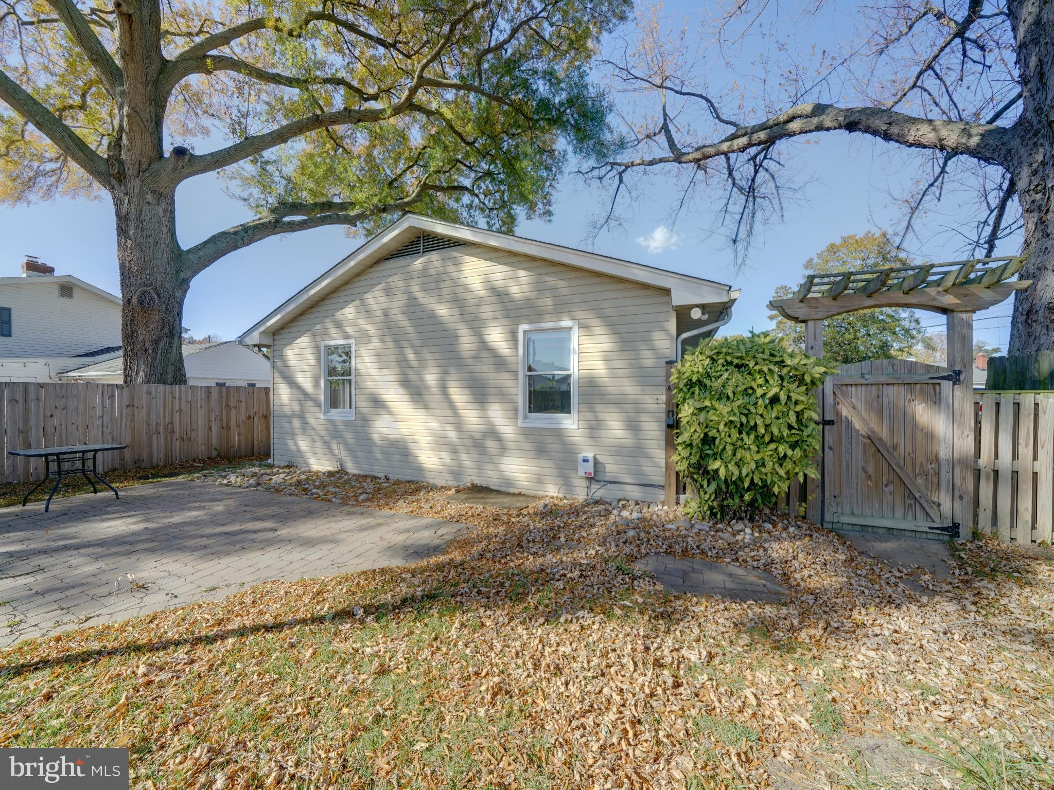 7819 Appletree Road Pasadena, MD 21122 - Photo 40 of 59 Charming backyard retreat with autumn leaves.
