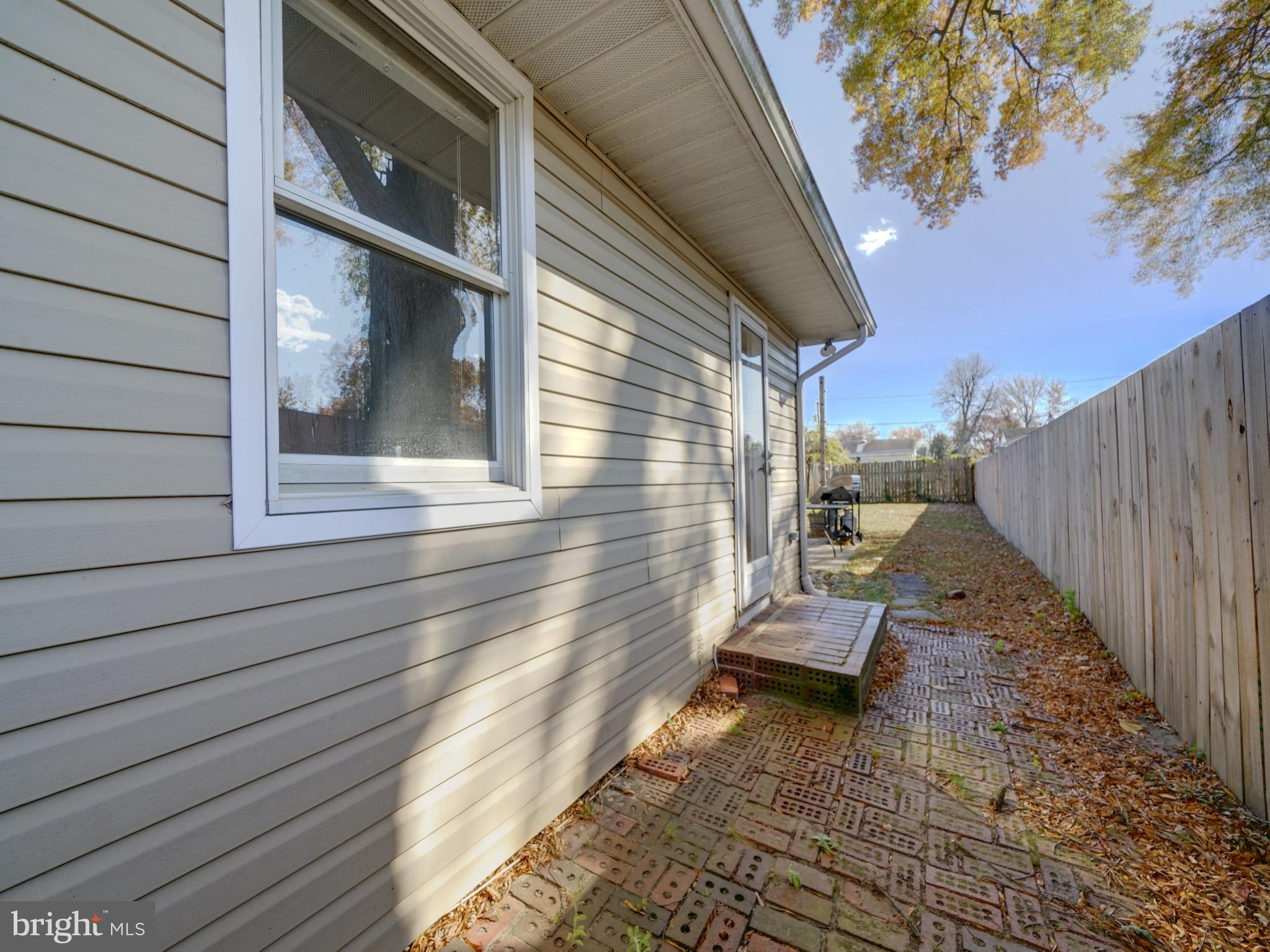 7819 Appletree Road Pasadena, MD 21122 - Photo 43 of 59 Charming side view of a cozy home.