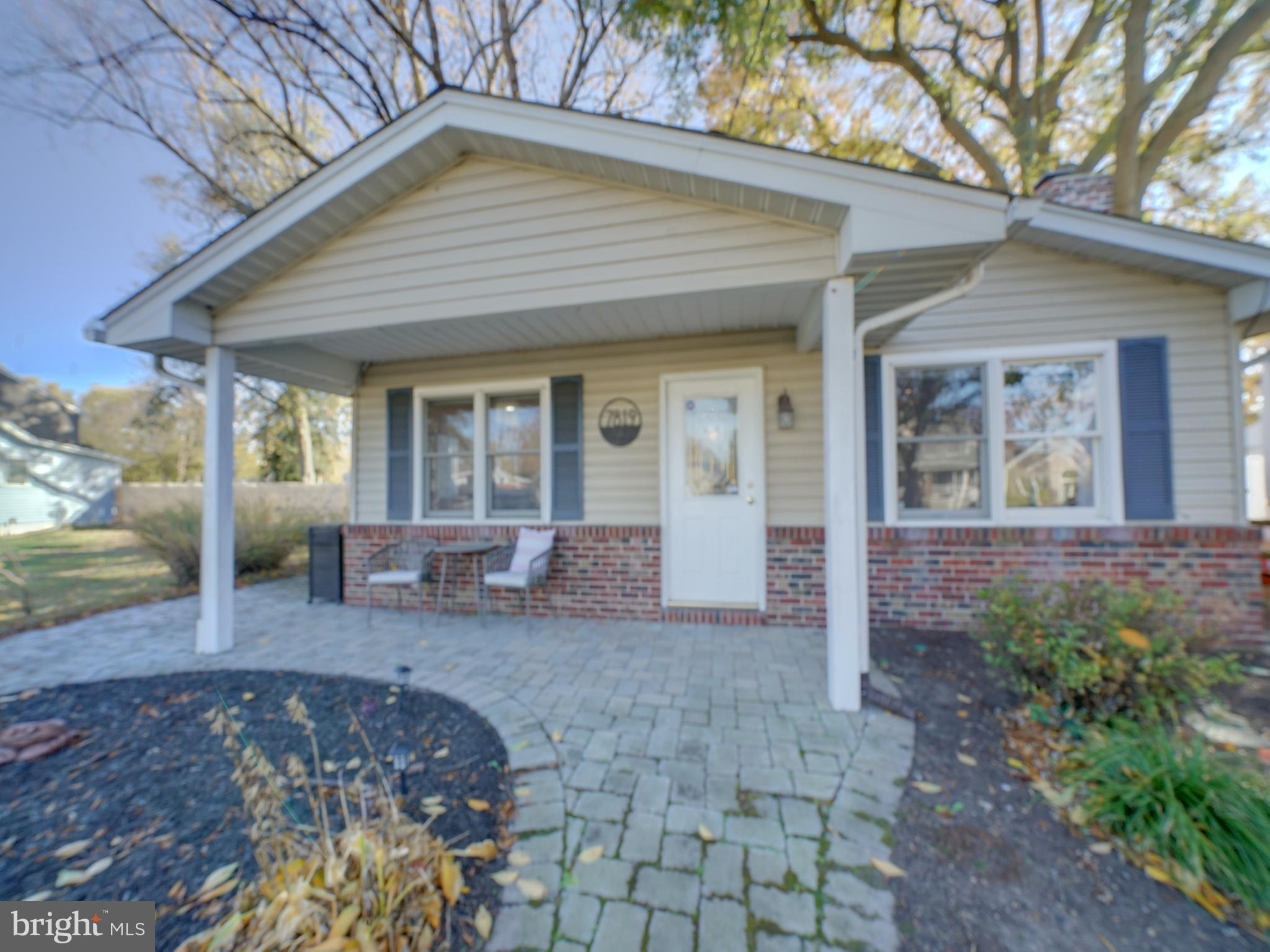 7819 Appletree Road Pasadena, MD 21122 - Photo 45 of 59 Charming front porch with inviting pathway.