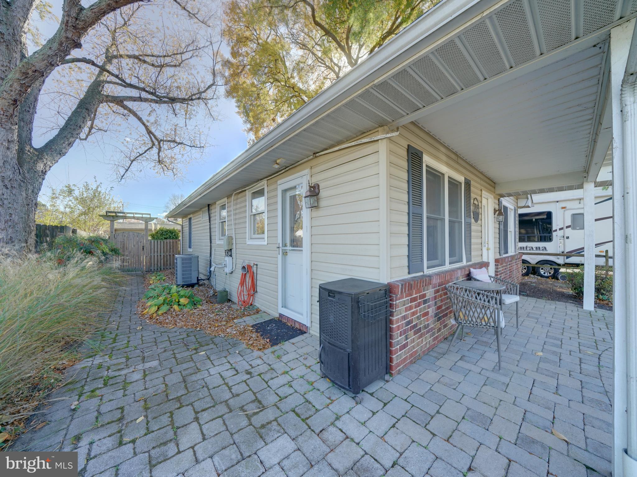 7819 Appletree Road Pasadena, MD 21122 - Photo 48 of 59 Charming exterior with inviting pathways.