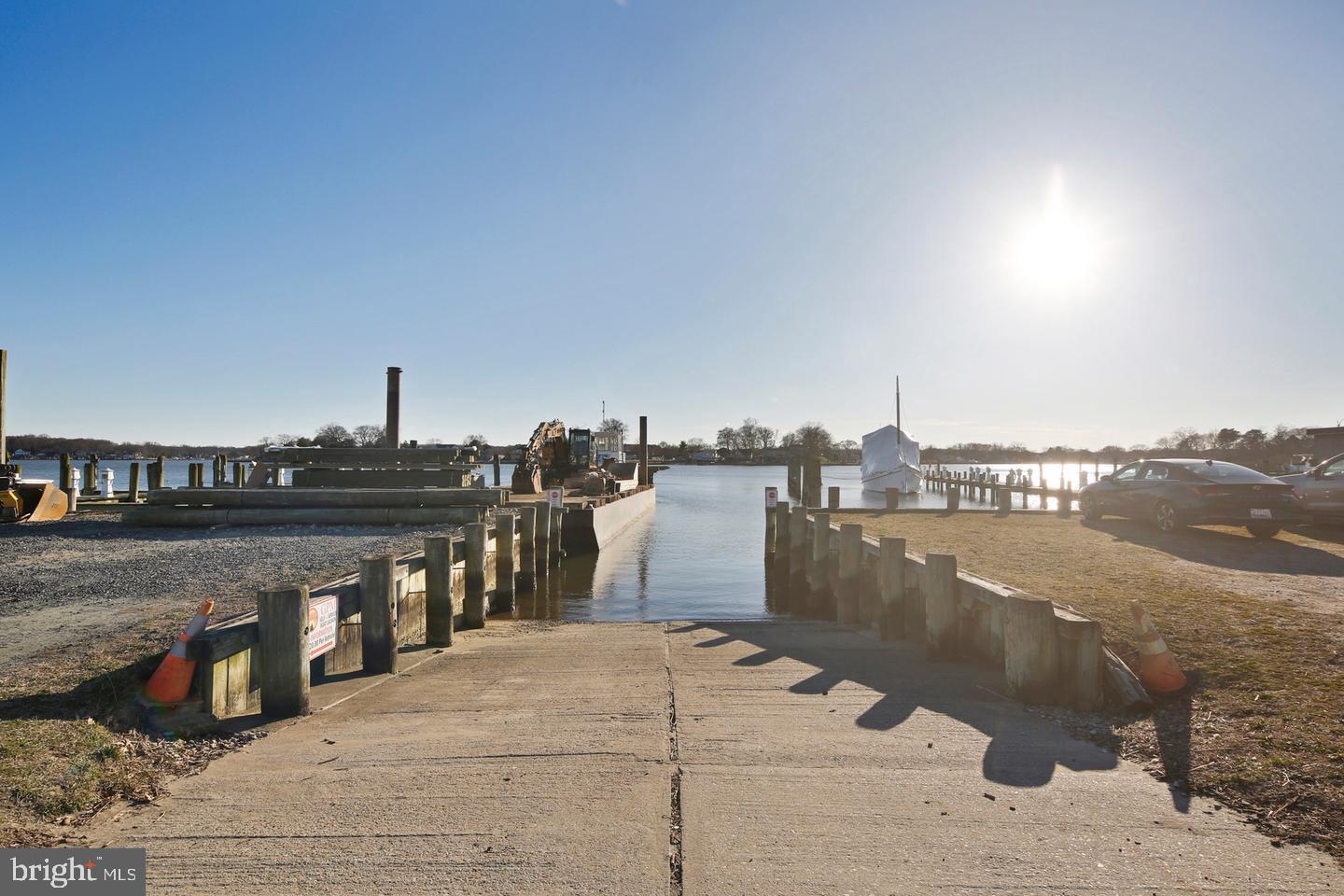 7819 Appletree Road Pasadena, MD 21122 - Photo 50 of 59 Scenic boat ramp under a bright sun.