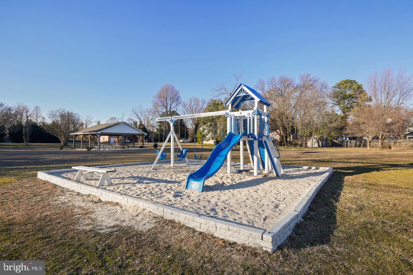 7819 Appletree Road Pasadena, MD 21122 - Photo 52 of 59 Playground oasis in a serene park setting.