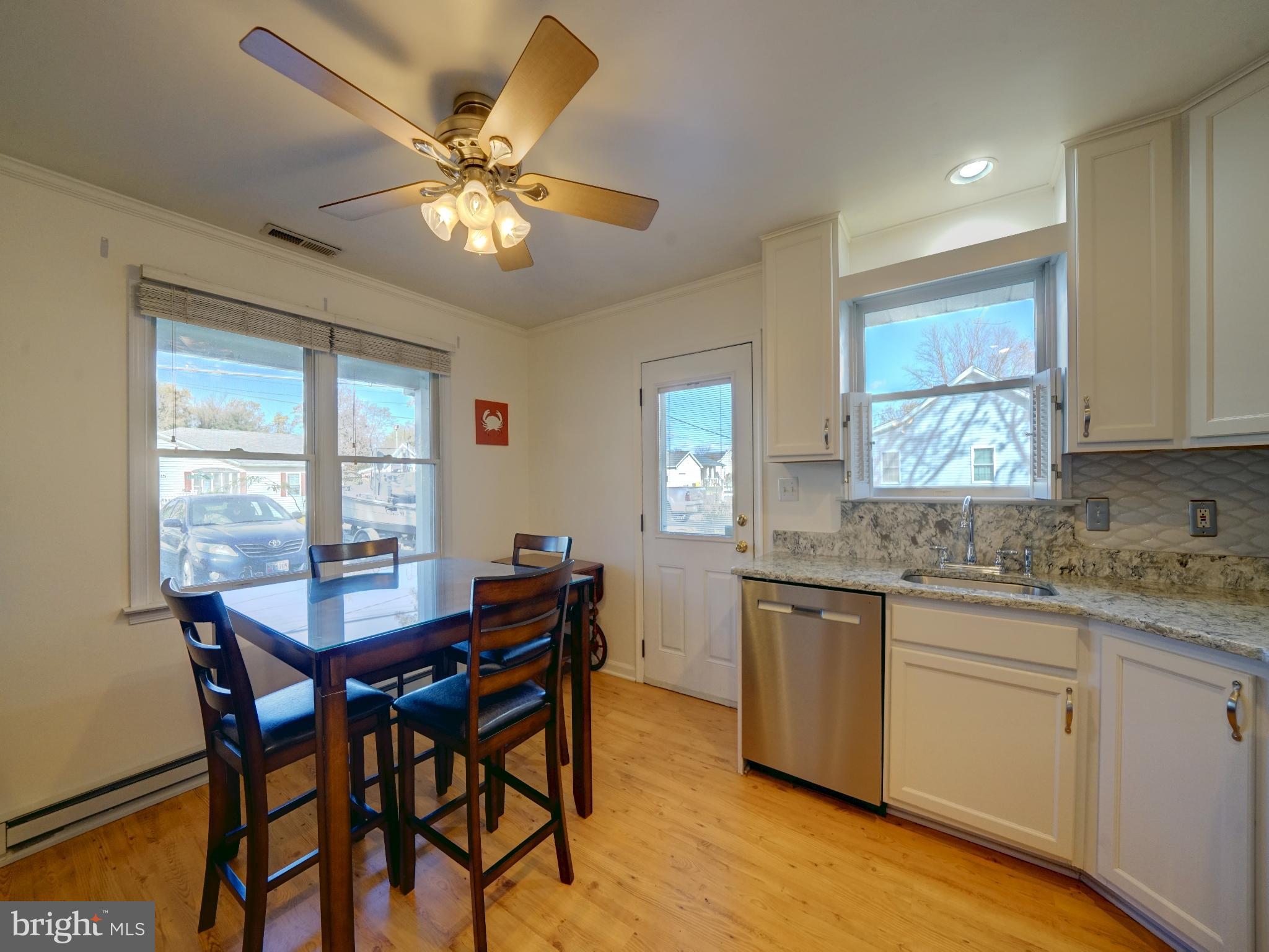 7819 Appletree Road Pasadena, MD 21122 - Photo 10 of 59 Bright and inviting kitchen with modern charm.