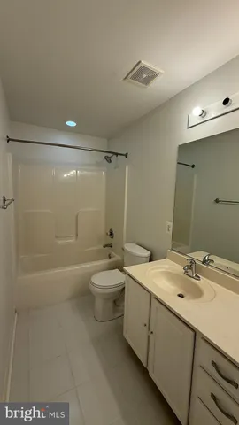 a spacious bathroom with a double vanity sink mirror and