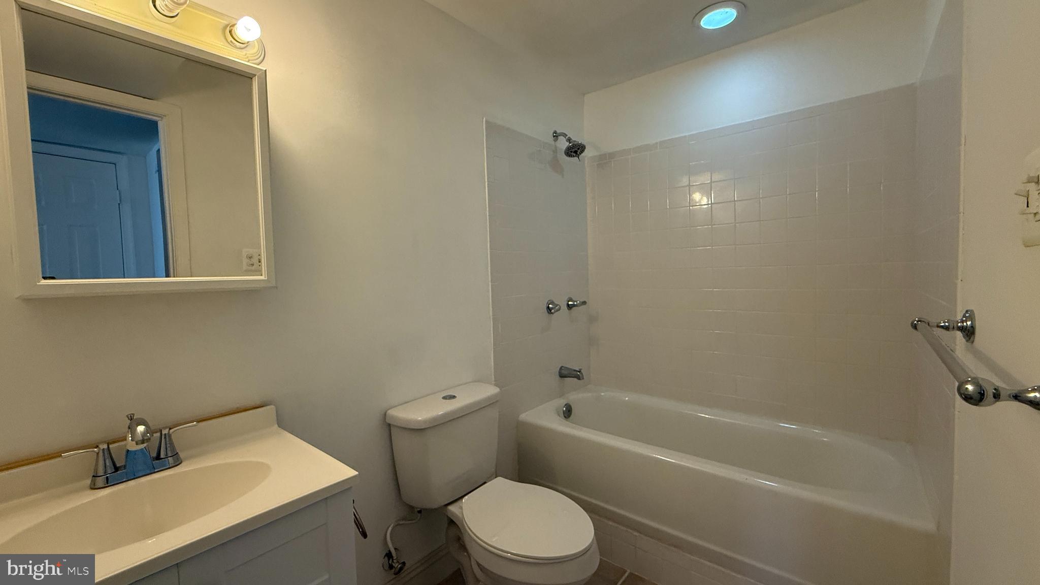 36 Tavern Road Stafford, VA 22554 - Photo 24 of 36 a white toilet sitting next to a bath tub