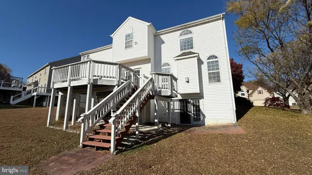 a view of a house with a yard and garage