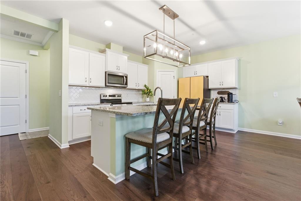 2106 Garden Place Atlanta, GA 30316 - Photo 13 of 37 a view of a dining room with furniture and wooden floor