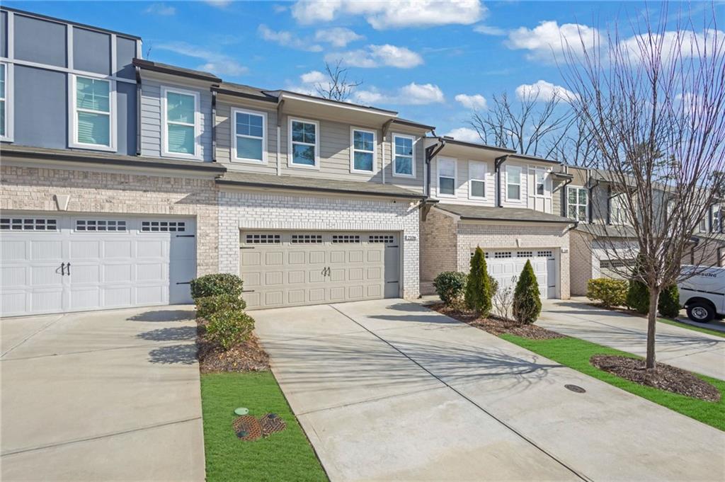 2106 Garden Place Atlanta, GA 30316 - Photo 2 of 37 a front view of a house with a yard and garage