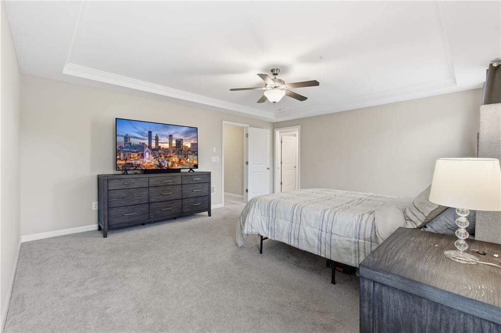 2106 Garden Place Atlanta, GA 30316 - Photo 21 of 37 a spacious bedroom with a bed and a lamp
