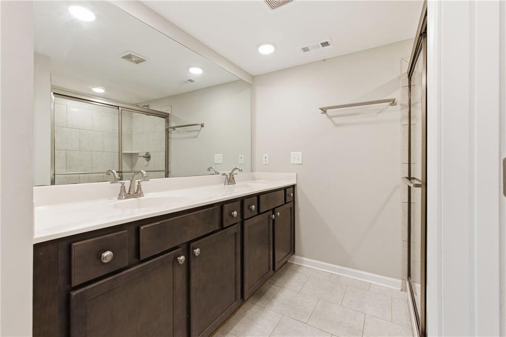 2106 Garden Place Atlanta, GA 30316 - Photo 22 of 37 a bathroom with a double vanity sink and mirror