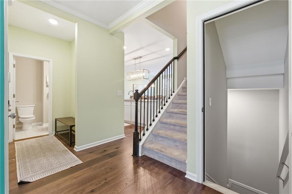 2106 Garden Place Atlanta, GA 30316 - Photo 30 of 37 a view of a hallway with wooden floor and staircase
