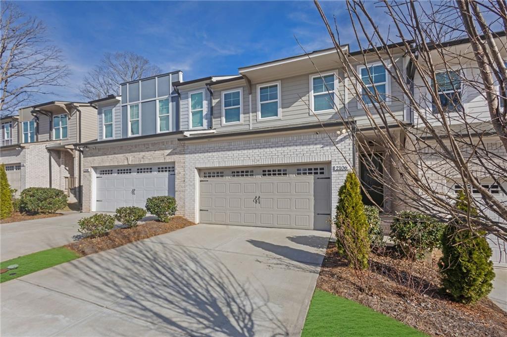 2106 Garden Place Atlanta, GA 30316 - Photo 3 of 37 a front view of a house with a yard and garage