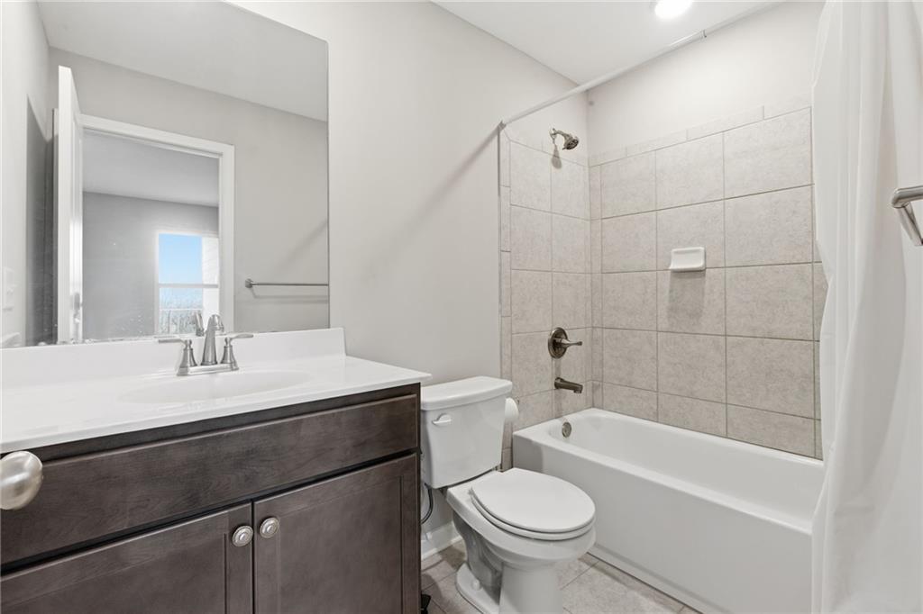 2106 Garden Place Atlanta, GA 30316 - Photo 33 of 37 a bathroom with a sink a toilet and shower