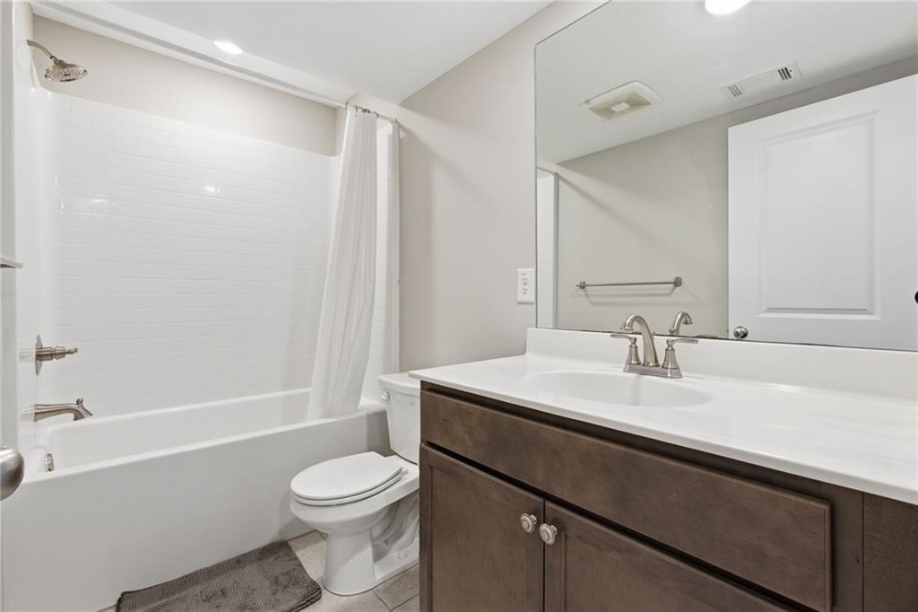 2106 Garden Place Atlanta, GA 30316 - Photo 34 of 37 a bathroom with a sink a toilet and shower