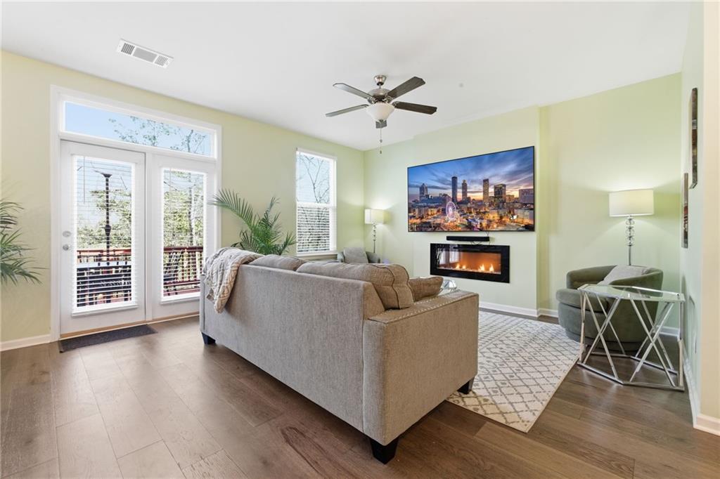 2106 Garden Place Atlanta, GA 30316 - Photo 6 of 37 a living room with furniture a flat screen tv and a fireplace