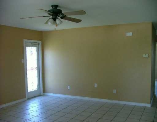 13953 Ketch Street Corpus Christi, TX 78418 - Photo 2 of 3 an empty room and chandelier fan