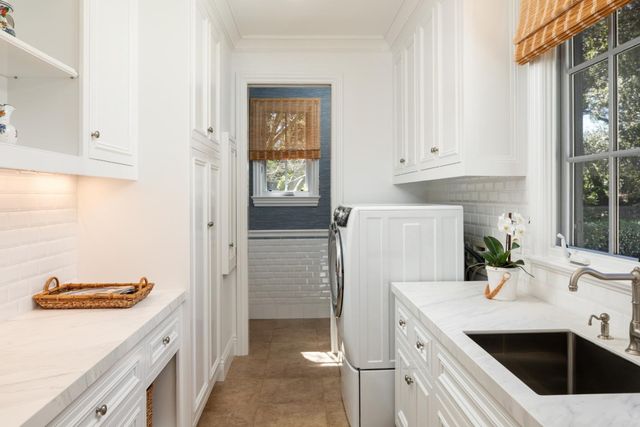 a kitchen with a sink and a refrigerator
