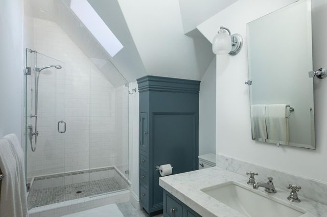 a view of table and chairs under an umbrella