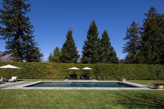 a view of a house with a back yard