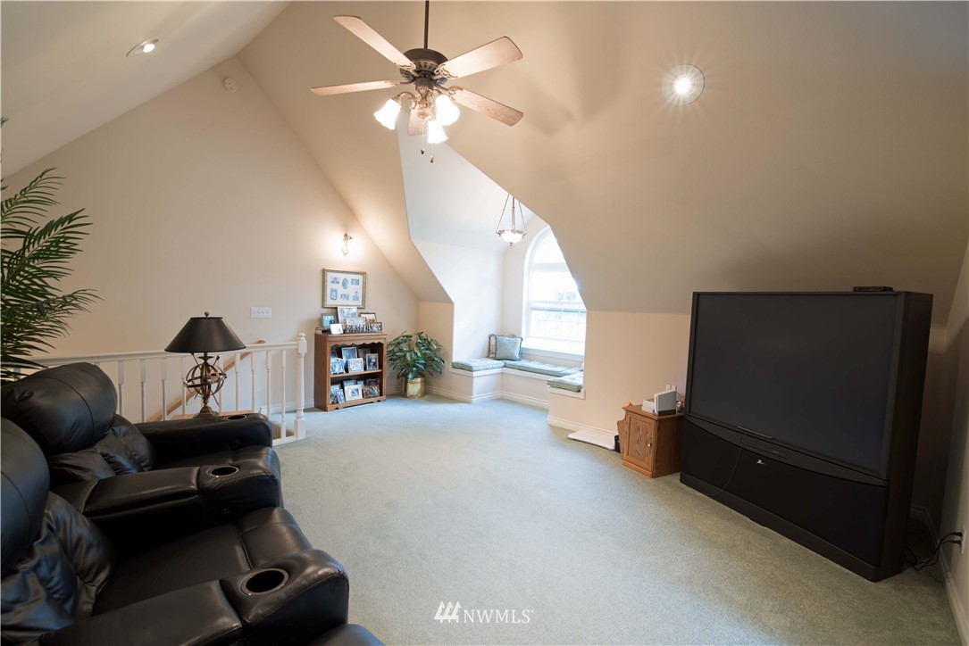 19333 Tall Firs Lane Southwest Rochester, WA 98579 - Photo 14 of 25 a living room with furniture and a flat screen tv