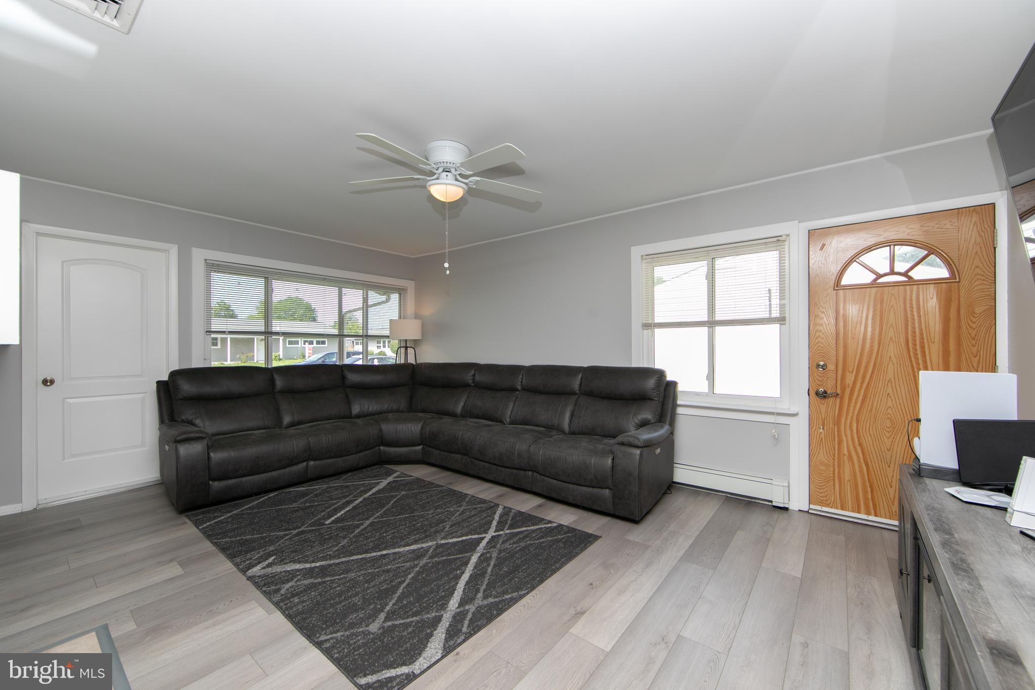 8 Boston Ivy Road Levittown, PA 19057 - Photo 11 of 31 Living area with access to utility and side yard