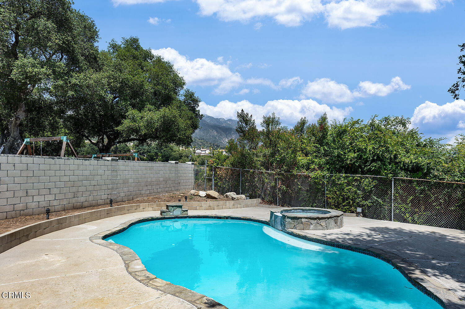 4176 Canyon Crest Road Altadena, CA 91001 - Photo 27 of 33 a view of a swimming pool with a yard