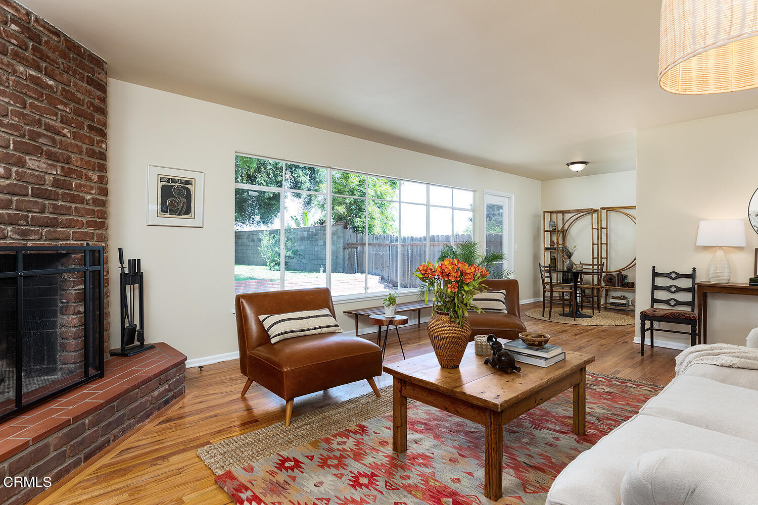 4176 Canyon Crest Road Altadena, CA 91001 - Photo 10 of 33 a living room with furniture a flat screen tv and a fireplace