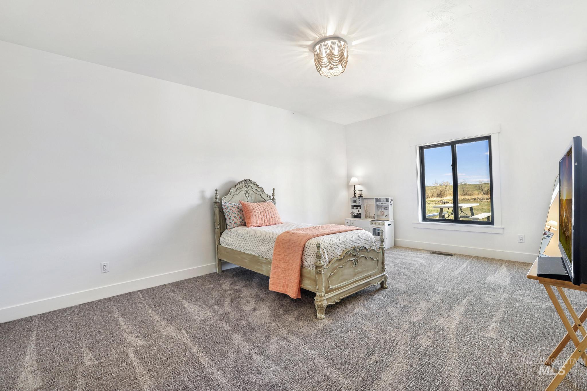 4288 North 2400 East Filer, ID 83328 - Photo 27 of 50 Carpeted bedroom featuring baseboards