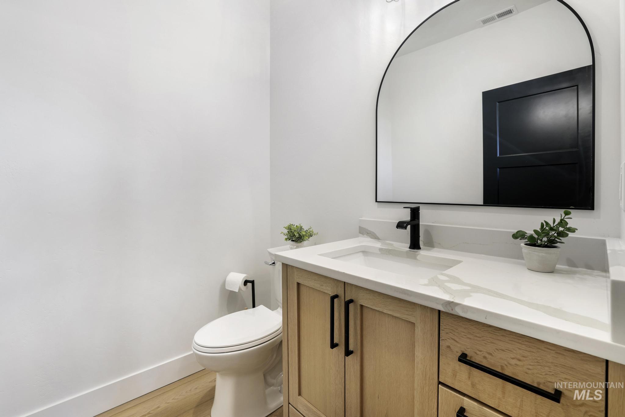 4288 North 2400 East Filer, ID 83328 - Photo 35 of 50 Bathroom with vanity and light wood-style flooring