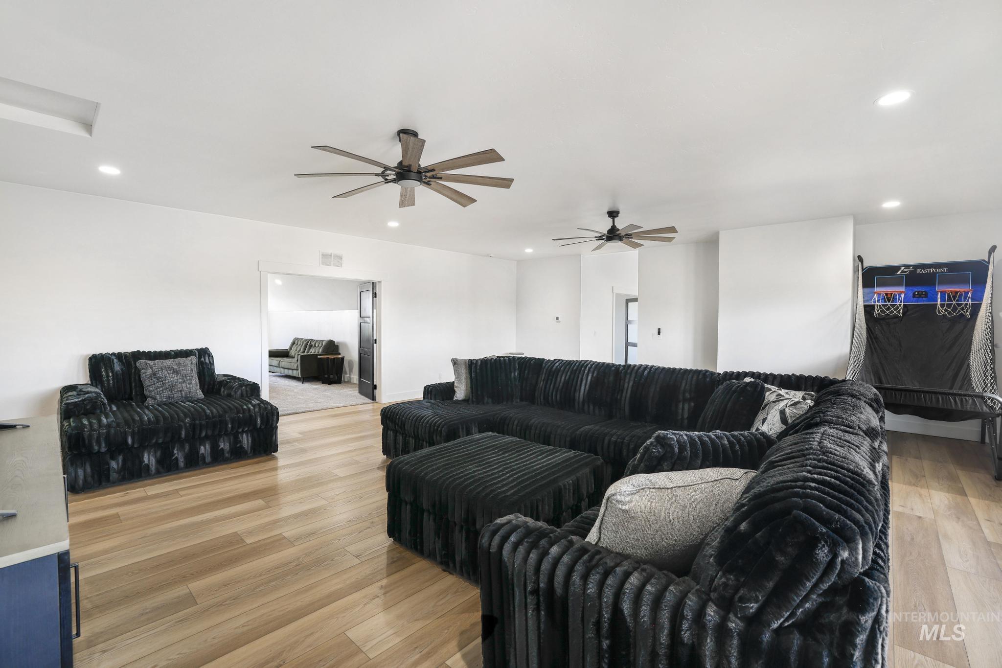 4288 North 2400 East Filer, ID 83328 - Photo 41 of 50 Living area with light wood-type flooring, recessed lighting, and ceiling fan