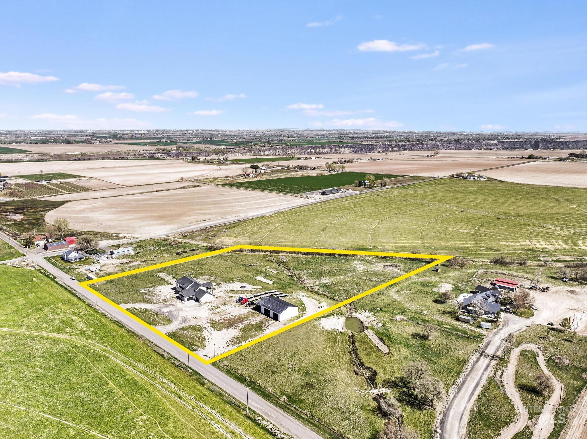 4288 North 2400 East Filer, ID 83328 - Photo 47 of 50 Aerial view of sparsely populated area featuring property parcel outlined and abundant farmland