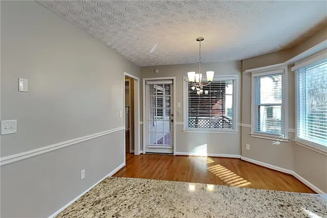 a very nice looking room with a large window and chandelier