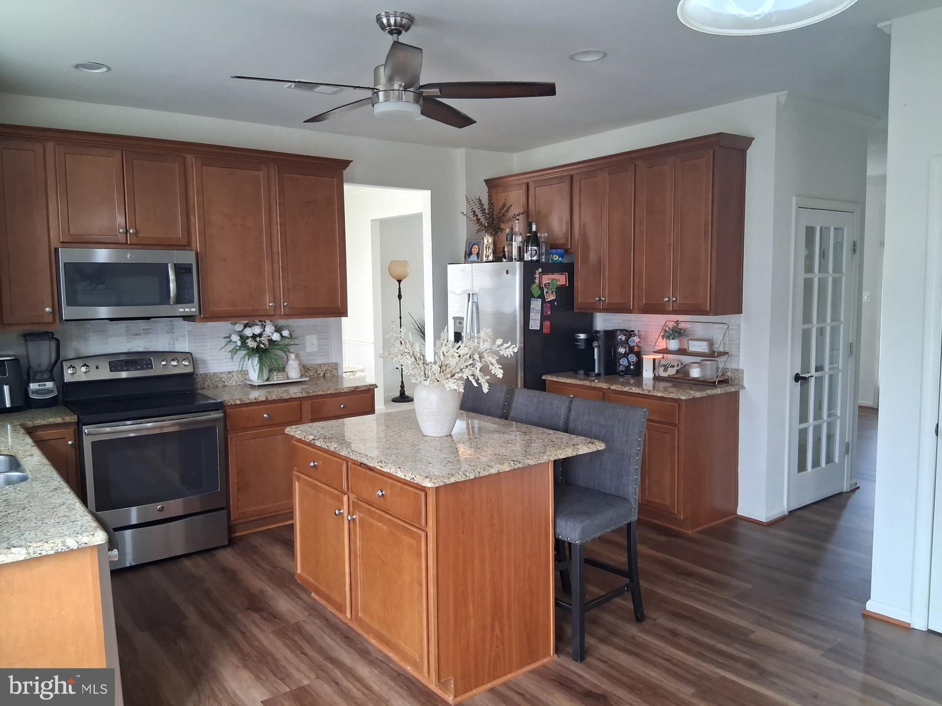 13944 Seneca Ridge Drive Hagerstown, MD 21740 - Photo 5 of 41 Modern kitchen with warm wood tones.