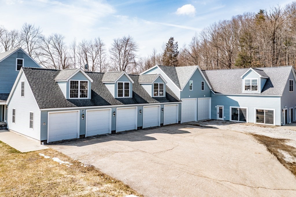 297 Brookfield Road Brimfield, MA 01010 - Photo 7 of 42 a front view of a house with a yard