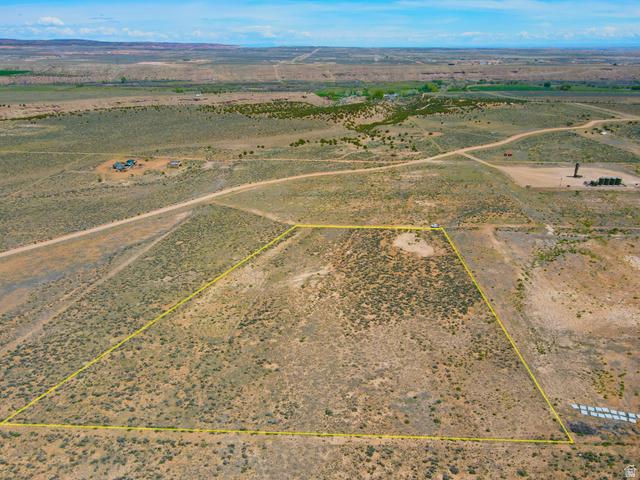 4500 South 22750th Duchesne, UT 84021 - Photo 27 of 34 Expansive desert landscape featuring a marked parcel of land, scattered vegetation, and a distant mountain range