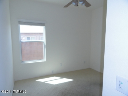 3544 East Mecate Road Tucson, AZ 85739 - Photo 11 of 14 a view of an empty room with a window