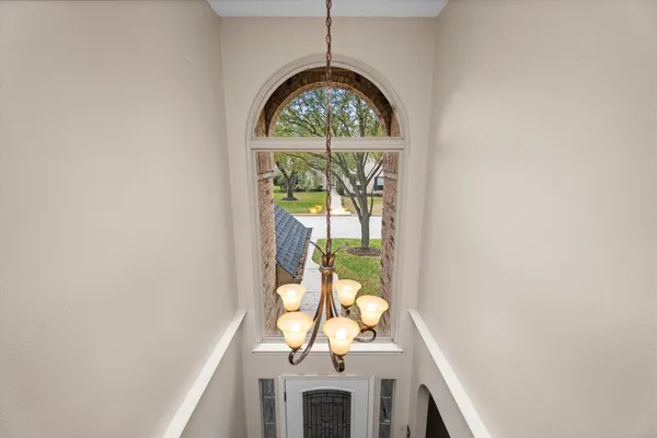 a view of empty room with ceiling fan