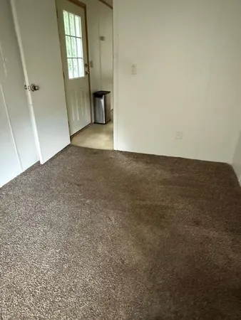 a house with trees in the background