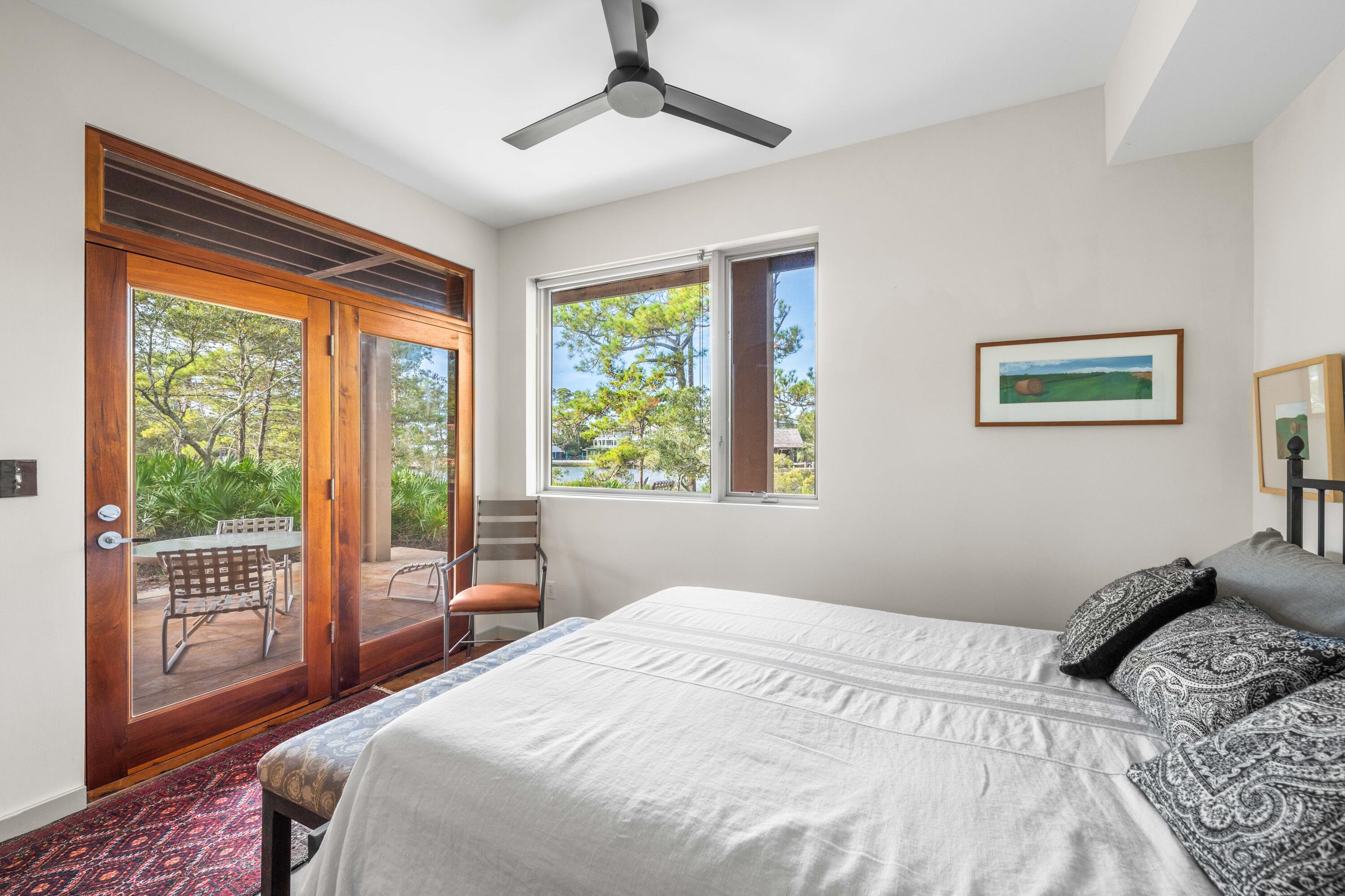 267 Wilderness Way Santa Rosa Beach, FL 32459 - Photo 27 of 71 a bedroom with a large bed and a balcony