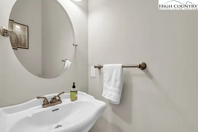 a bathroom with a sink and mirror