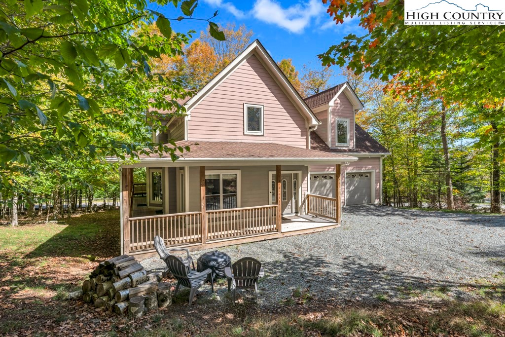 100 Northridge Road Beech Mountain, NC 28604 - Photo 2 of 32 a view of a house with a yard