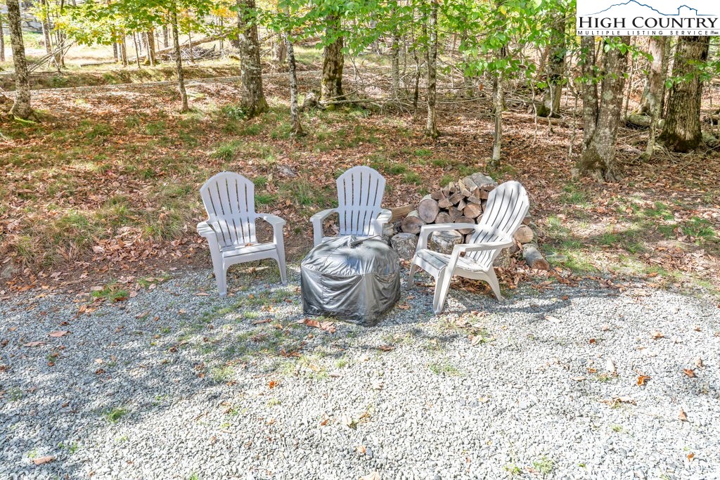 100 Northridge Road Beech Mountain, NC 28604 - Photo 30 of 32 a view of a chairs and table in the backyard