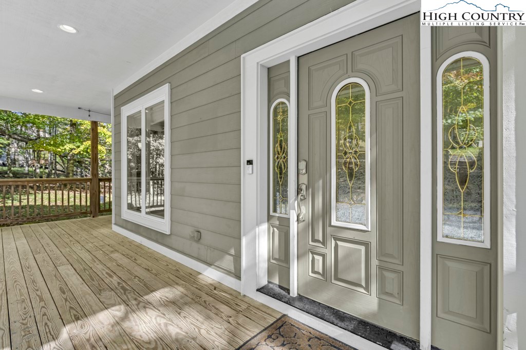 100 Northridge Road Beech Mountain, NC 28604 - Photo 4 of 32 a front view of a house with a porch