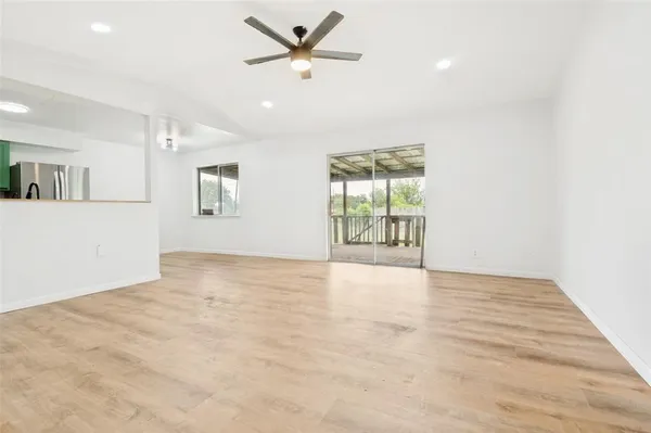 a view of an empty room with a window