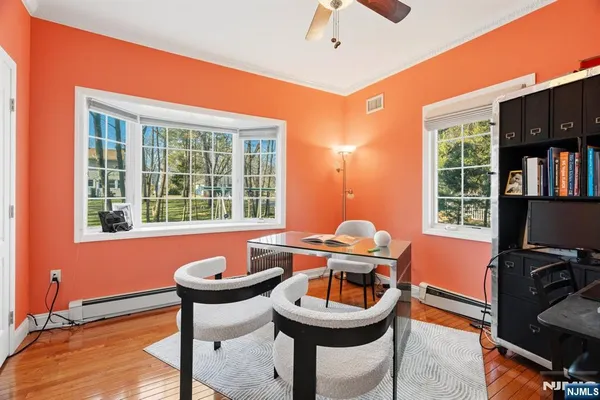 a dining room with furniture and window